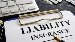 Liability Insurance Written On A Paper & Attached To The Clipboard